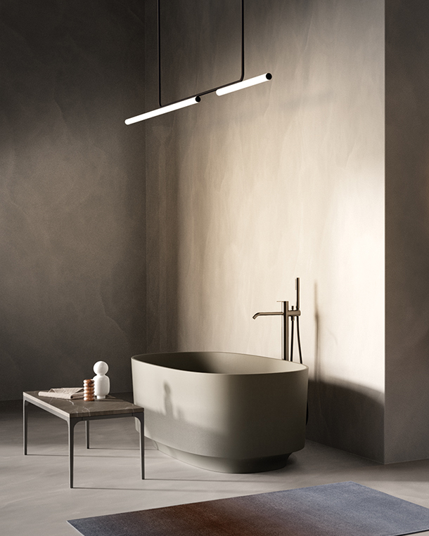 Modern bathroom with stone tub and suspended ceiling light